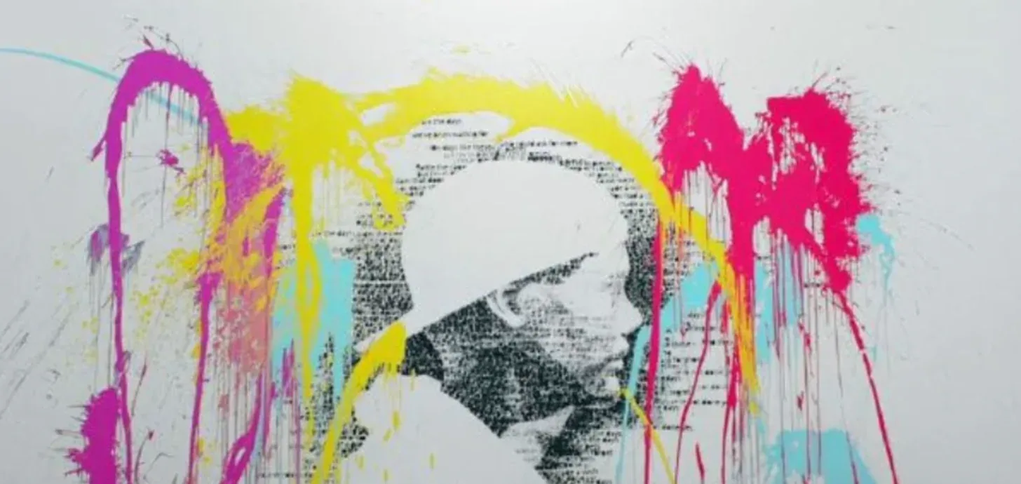 The lyric portrait of Avicii splashed with magenta, yellow and cyan paint.