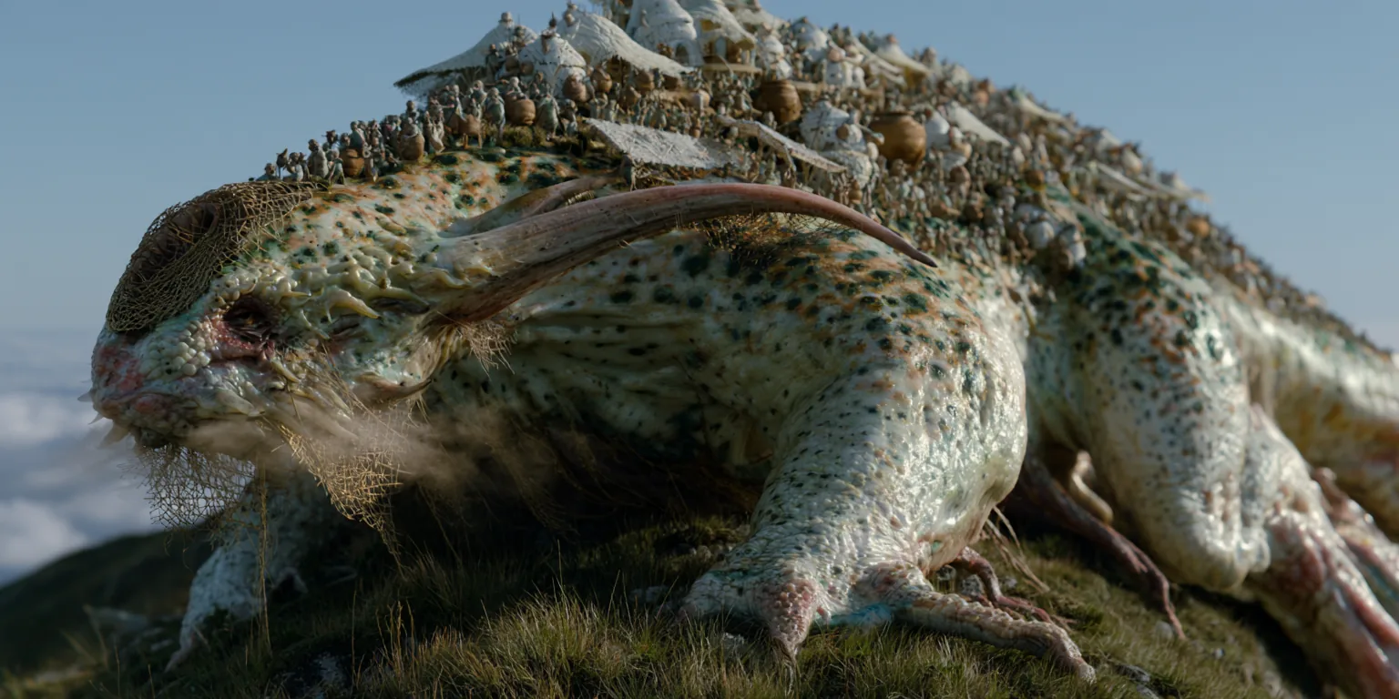 A huge speckled creature resting on a grassy ridge above the clouds.